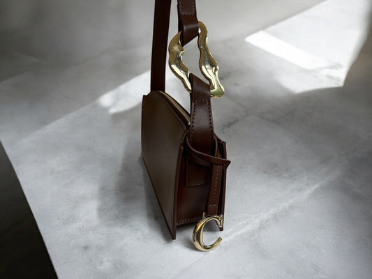 nicolebagclariteEveningbagstatementgolddetailingvintagebigbucklebrowncloseupshoulderbagdetailformalcocktail