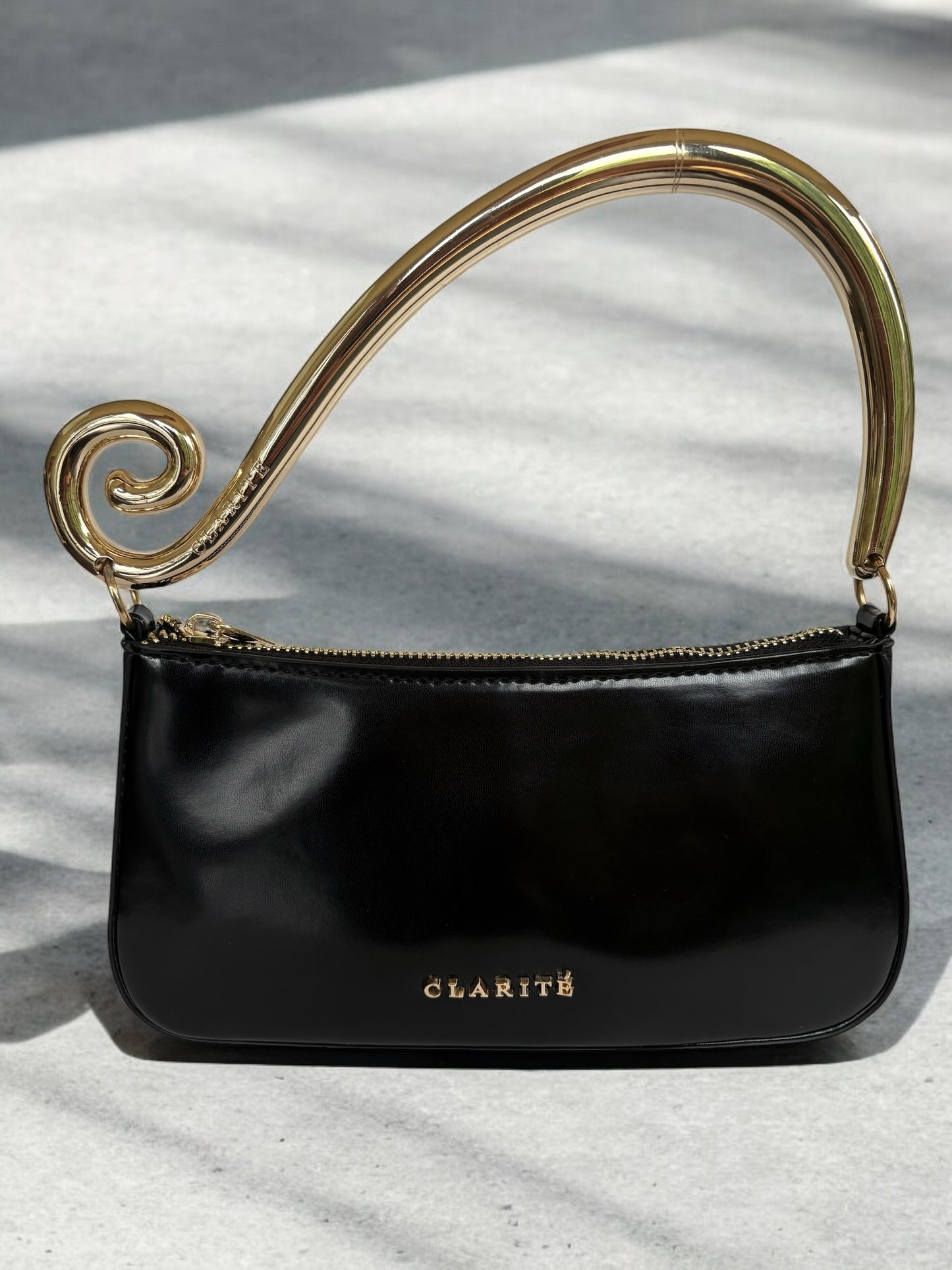 clariteGoldandBlackshoulderbagEveningbagstatementbiggoldhandleswirlshoulderdetailformalcocktail